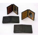 A group of four Victorian daguerreotypes housed in embossed cases,