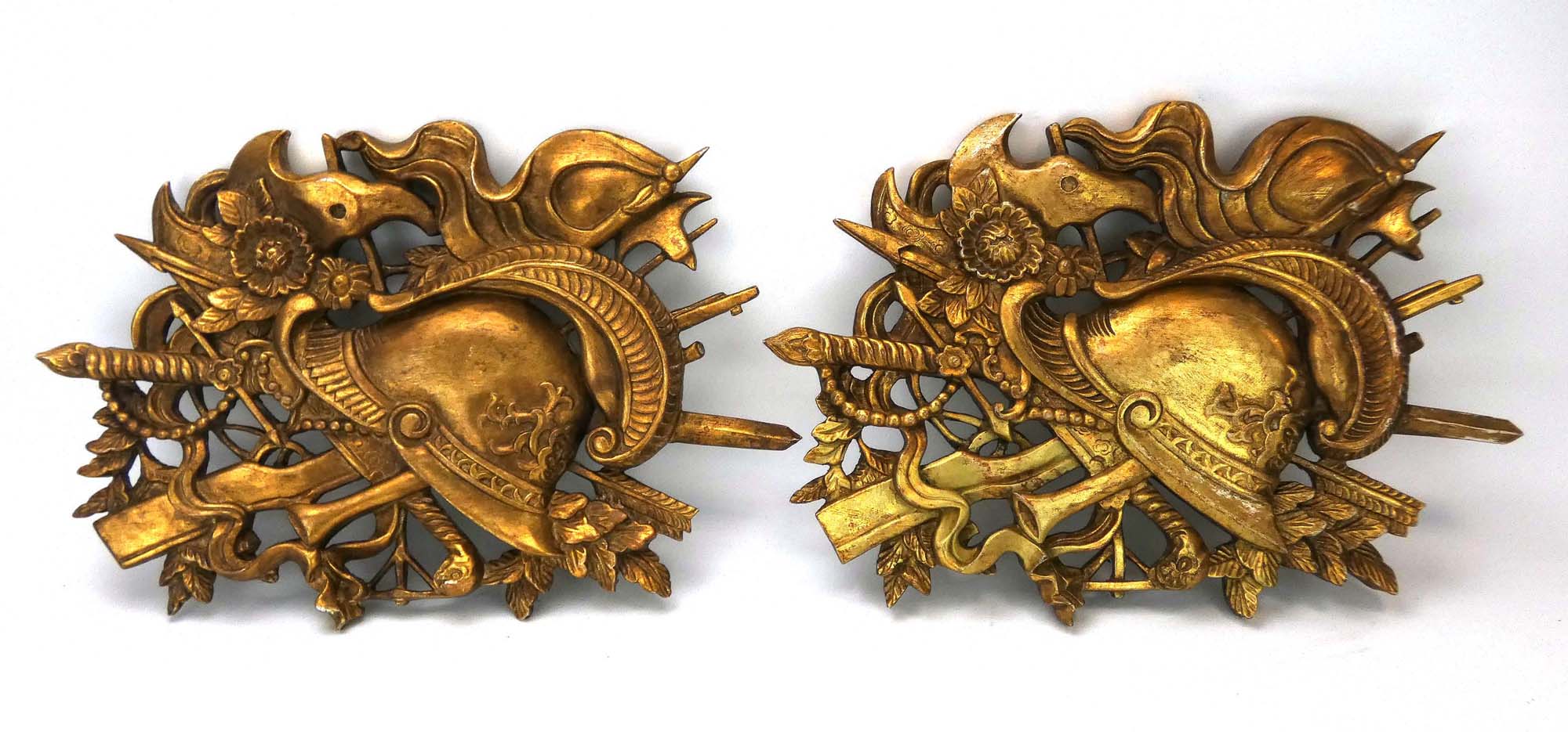 A pair of gilded fruitwood Stand of Arms plaques,