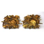 A pair of gilded fruitwood Stand of Arms plaques,