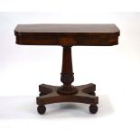 A Regency rosewood, crossbanded and marquetry games table on an acanthus capped column,