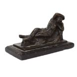 A brown patinated bronze figure modelled as a lady reclining on a rock, on a marble plinth,