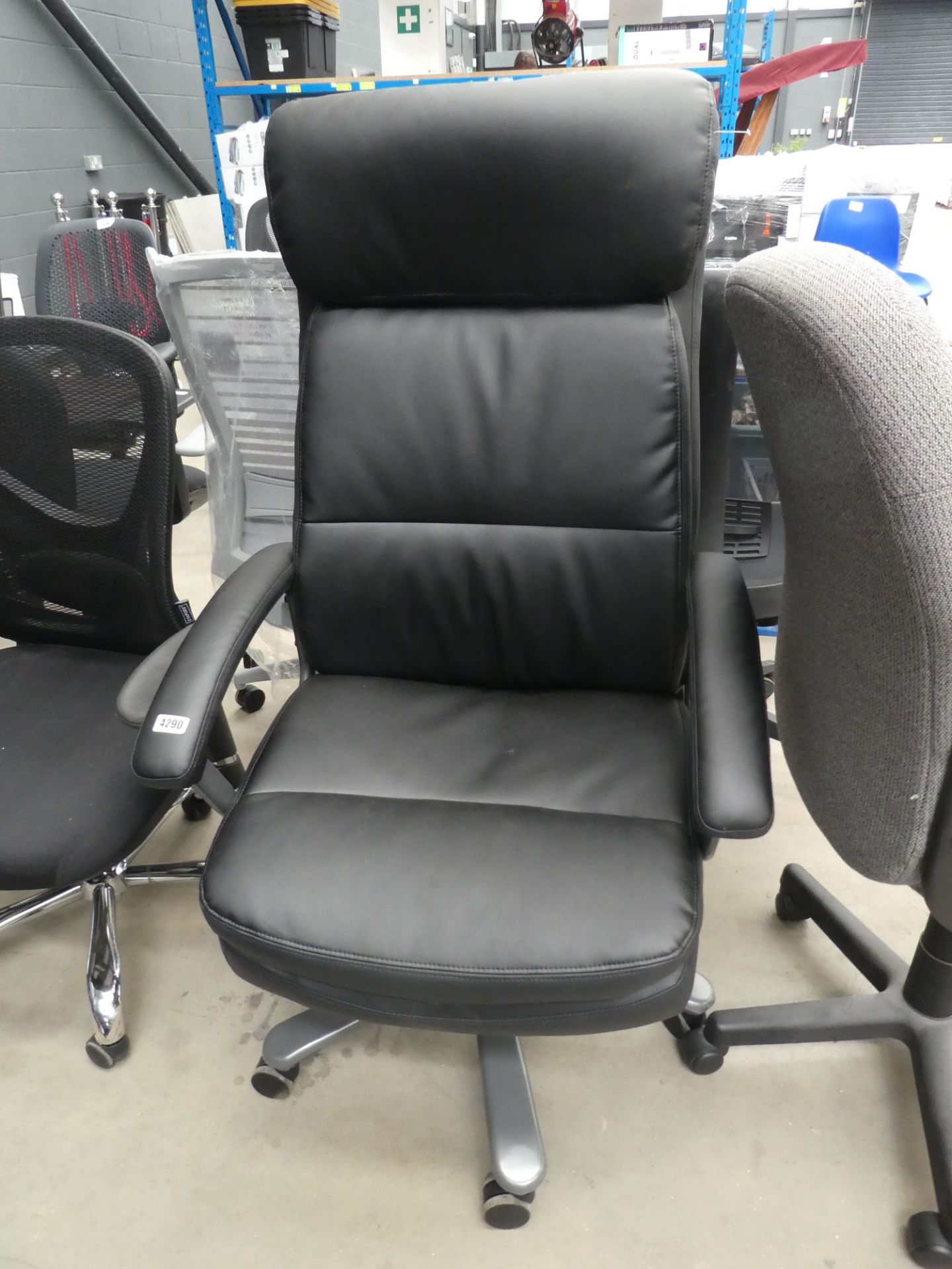 Black high backed swivel armchair