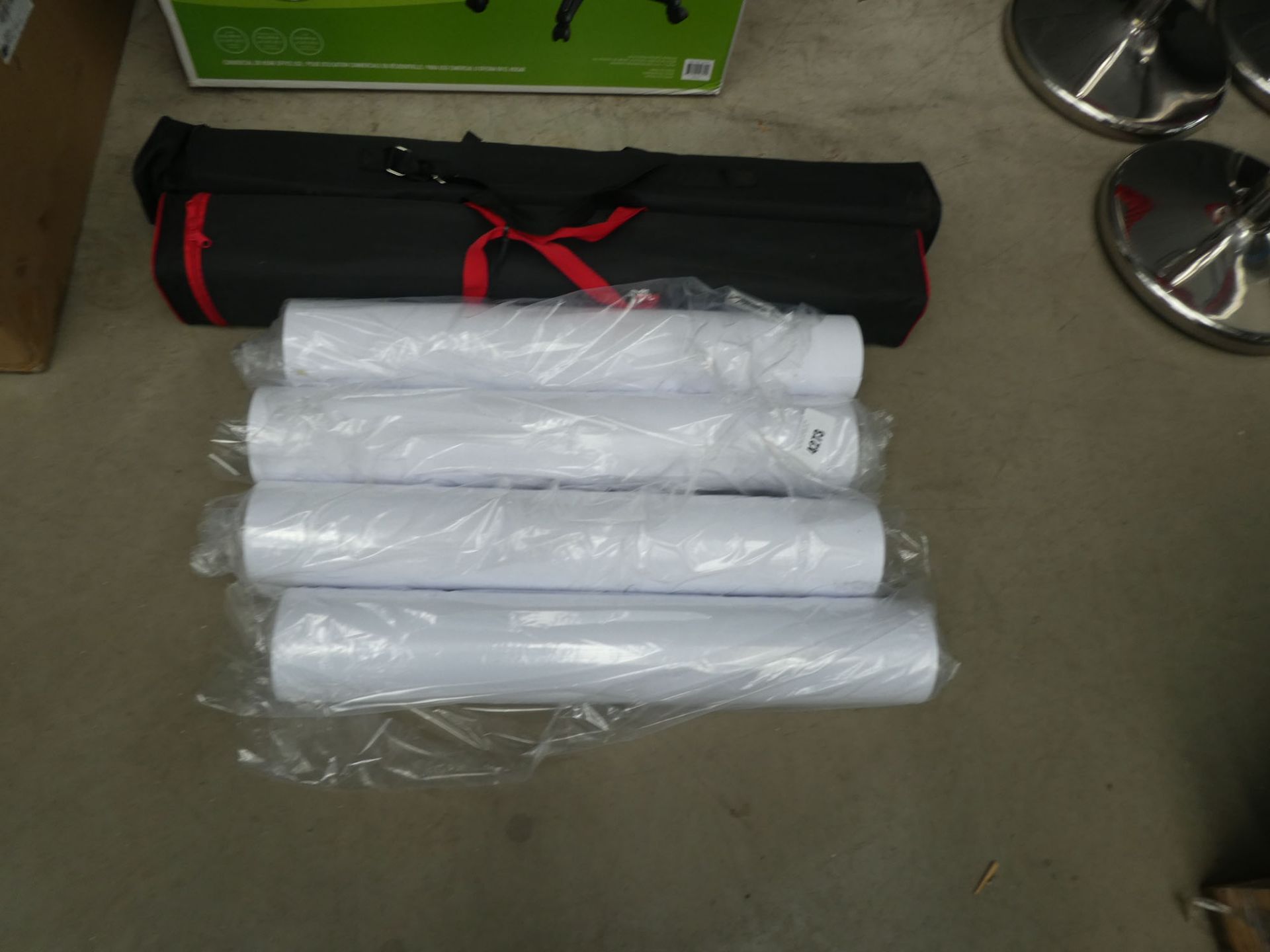 Rolls of paper and 2 display stands