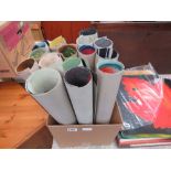 Box containing various rolled up pictures