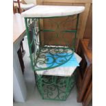 Corner wrought iron table with marble top together with one similar
