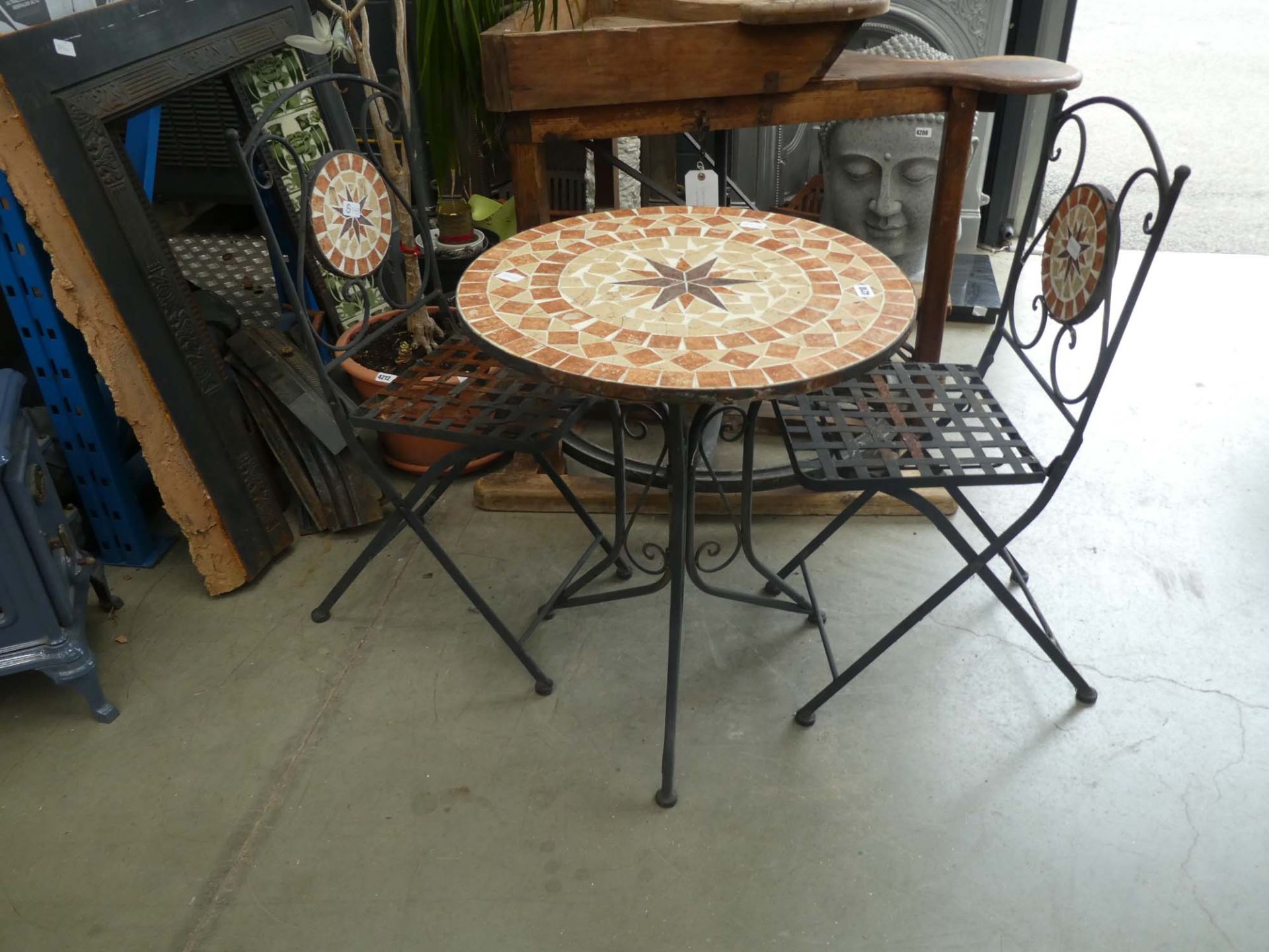 Small tile topped round garden table and two chairs