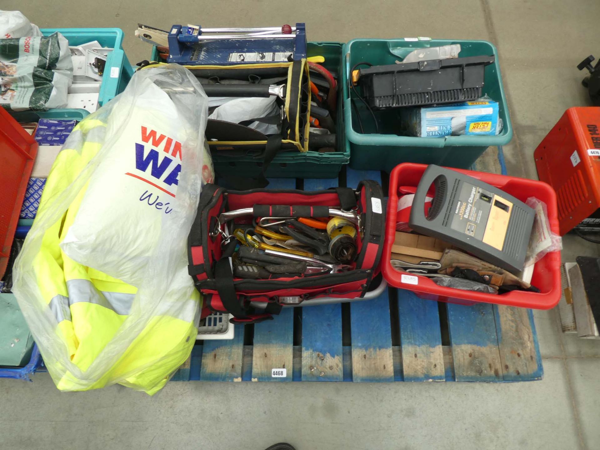 Pallet containing large amount of tools incl. tool bag, battery charger, fluorescent jackets, etc.