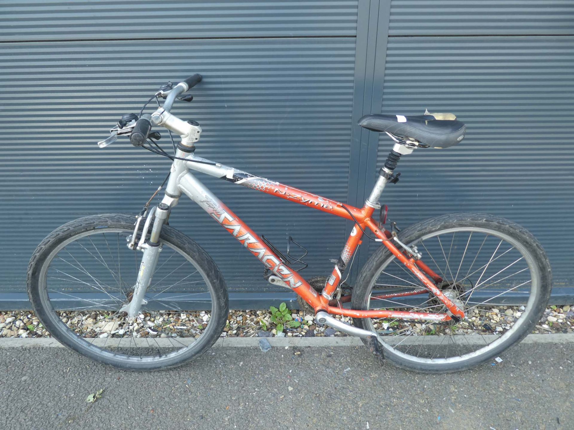 Saracen silver and orange mountain bike