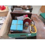 Box containing clocks, watches, corkscrew, boxes, lights, and set of fishing scales Both modern,