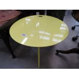 Yellow painted metal table on hairpin supports