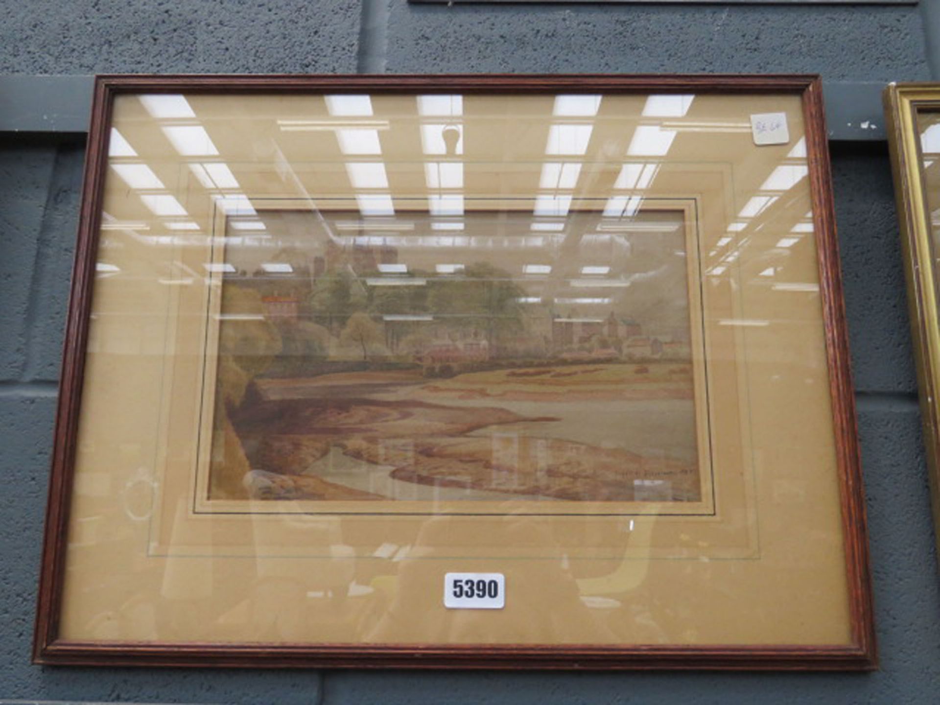 Framed and glazed watercolour of buildings and river estuary