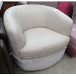 Cream leather effect swivel armchair