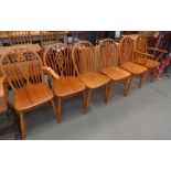 Six wheelback beech dining chairs to include two carvers