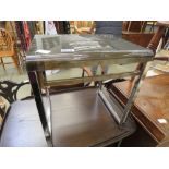 Bent plastic and chrome side table