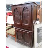 5148 pair of brown painted storage cabinets with wicker panels