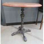 Circular pub table on cast iron base