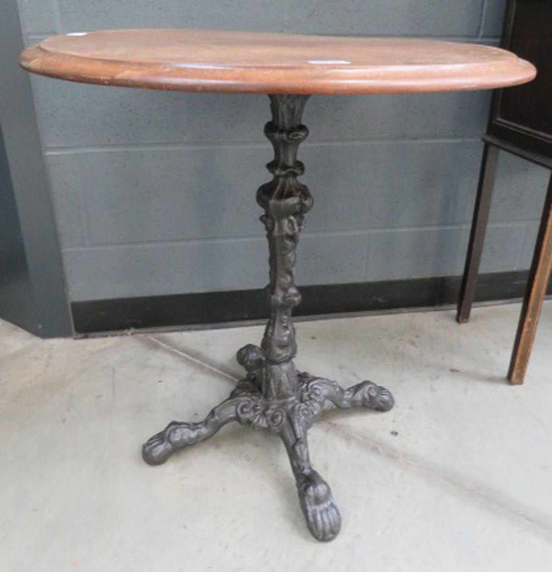 Circular pub table on cast iron base