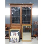 oak double door bookcase with cupboard base with glazed and leaded panels