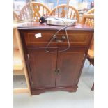 Reproduction mahogany double-door cupboard with drawer over