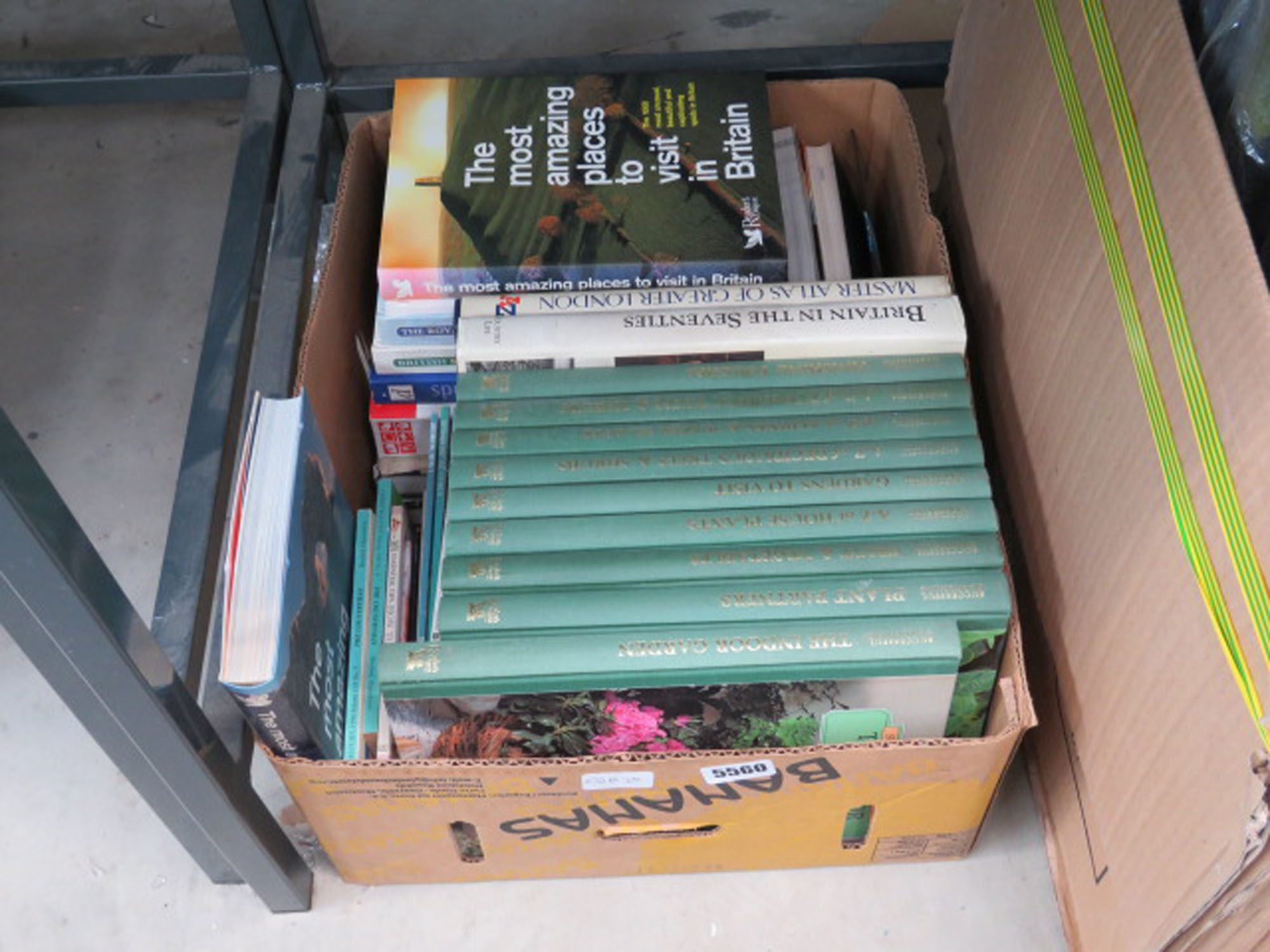 Box containing Readers Digest reference books