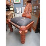 Carved chair with leather effect seats
