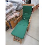 Teak steamer chair with green canvas cushions