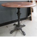 Circular pub table on cast iron base