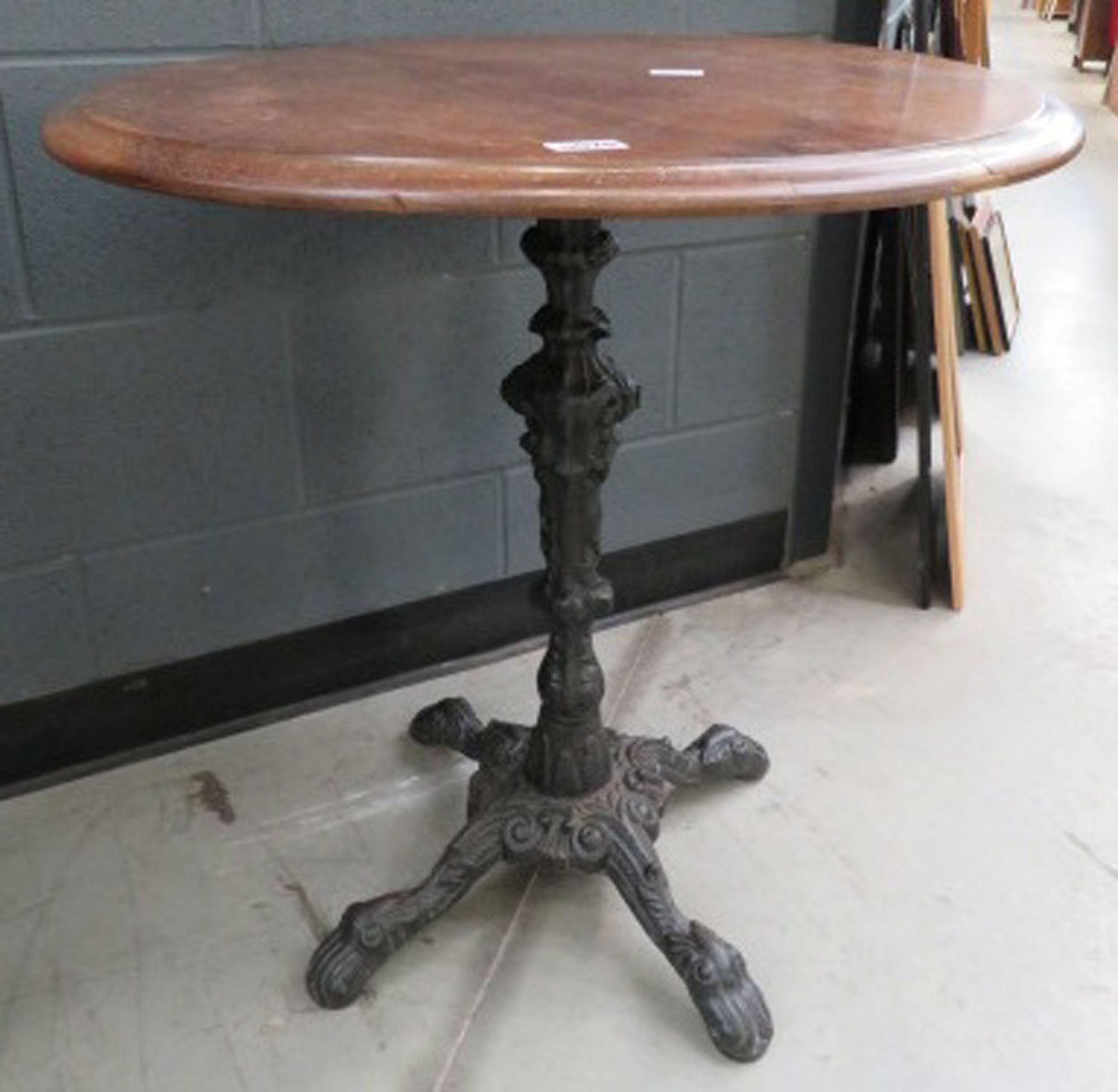 Circular pub table on cast iron base