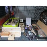 Cage containing costume jewellery, wrist watches, photo graphs and trinkets