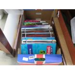 Box containing GCSE Geography and English text books