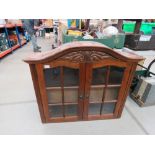 Oak dome topped and glazed double door display cupboard