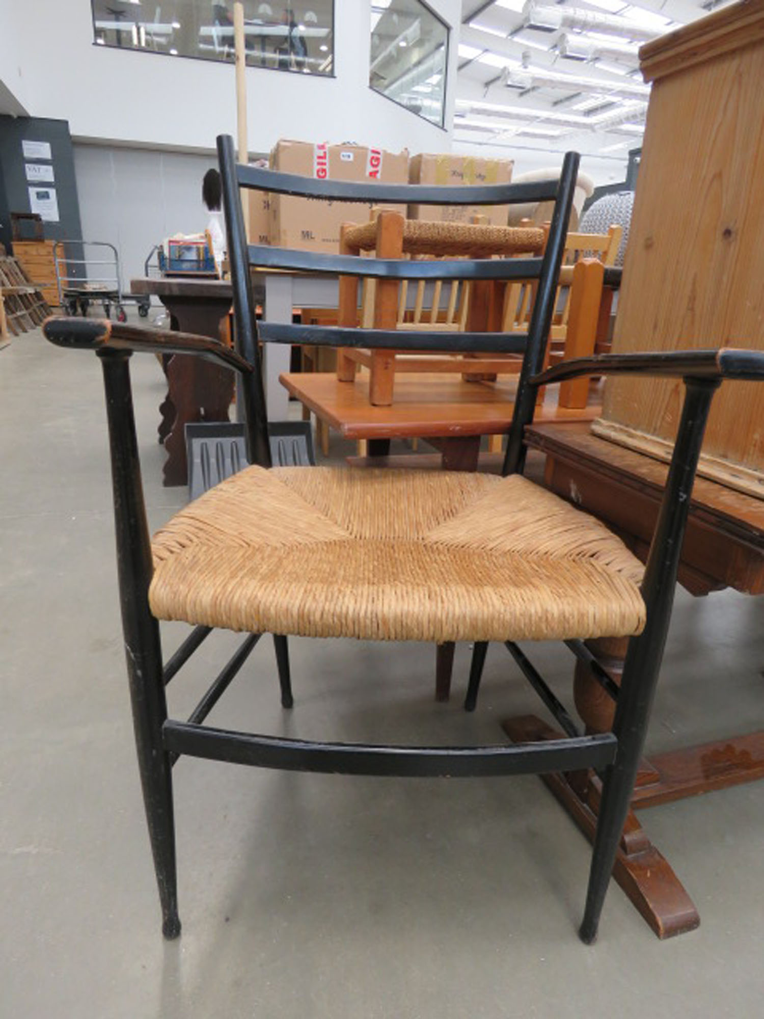 Black painted armchair with rush seat