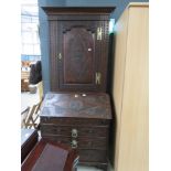 Heavily carved oak bureau bookcase