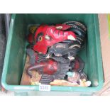 Box of carved and painted wooden masks plus a cow creamer and a duc shaped salt and pepper set