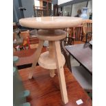 Lime washed adjustable tripod stool