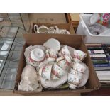 2 boxes containing Indian Tree and country garden pattern crockery