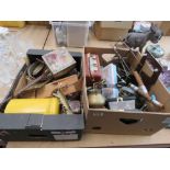 2 boxes containing brassware, ornamental anchors, vintage radio, lion winders, games and general