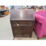 Oak bureau with cupboard and drawer under