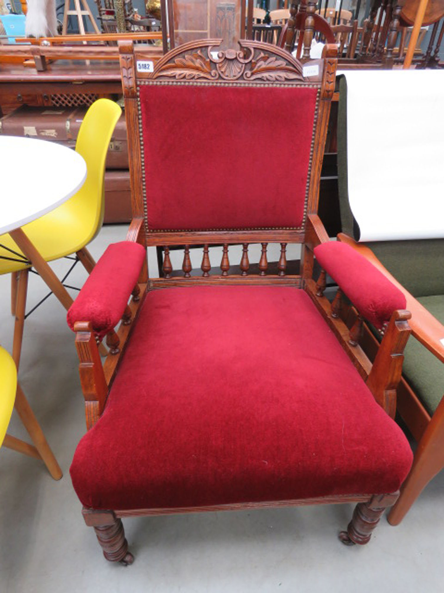 Carved Edwardian armchair with maroon fabric