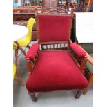 Carved Edwardian armchair with maroon fabric