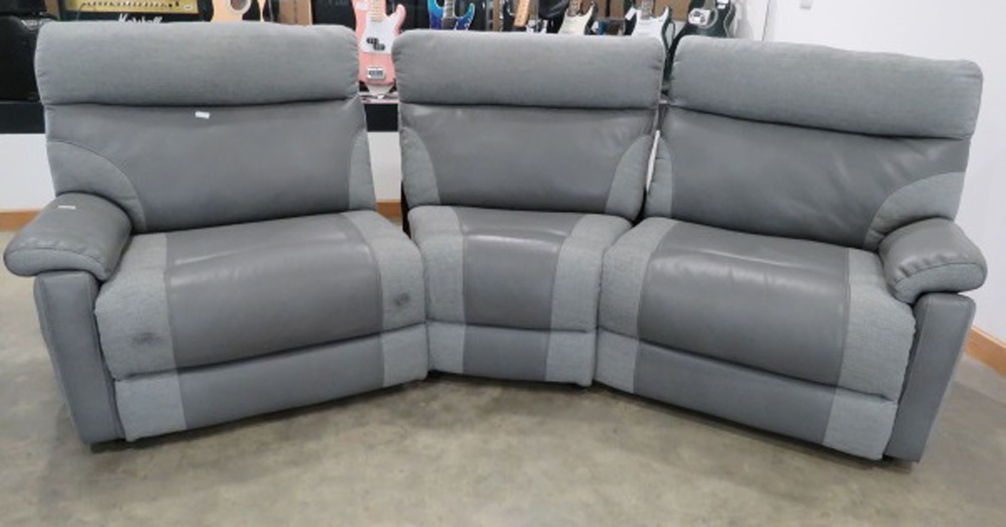 Grey leather effect and fabric curved modular three seater sofa