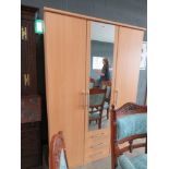 5343 Beech finished wardrobe with central mirrored door and drawers under