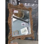 Rectangular bevelled mirror with ornate resin frame