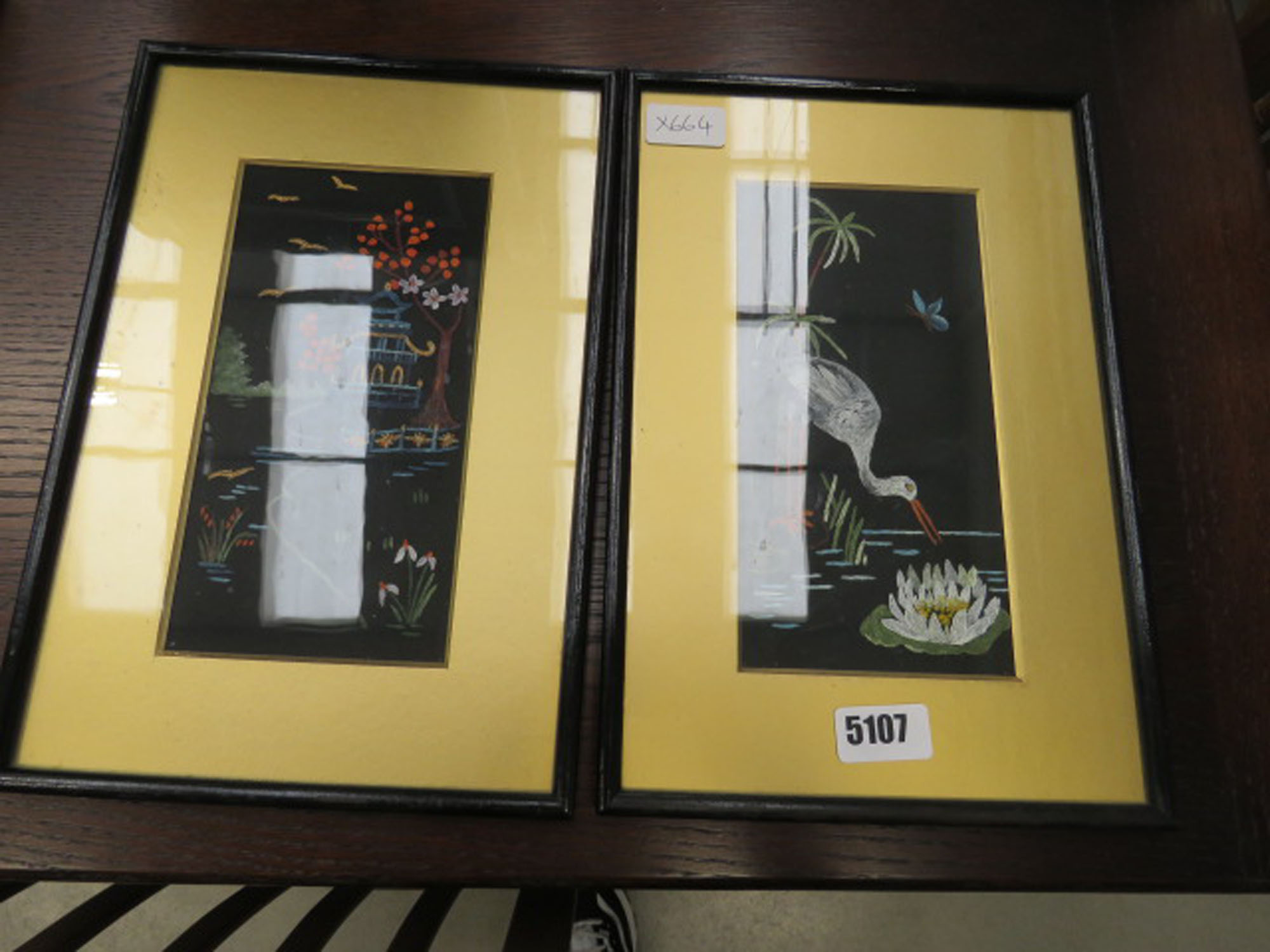 Pair of framed and glazed oriental paintings - the Pagoda and Stork