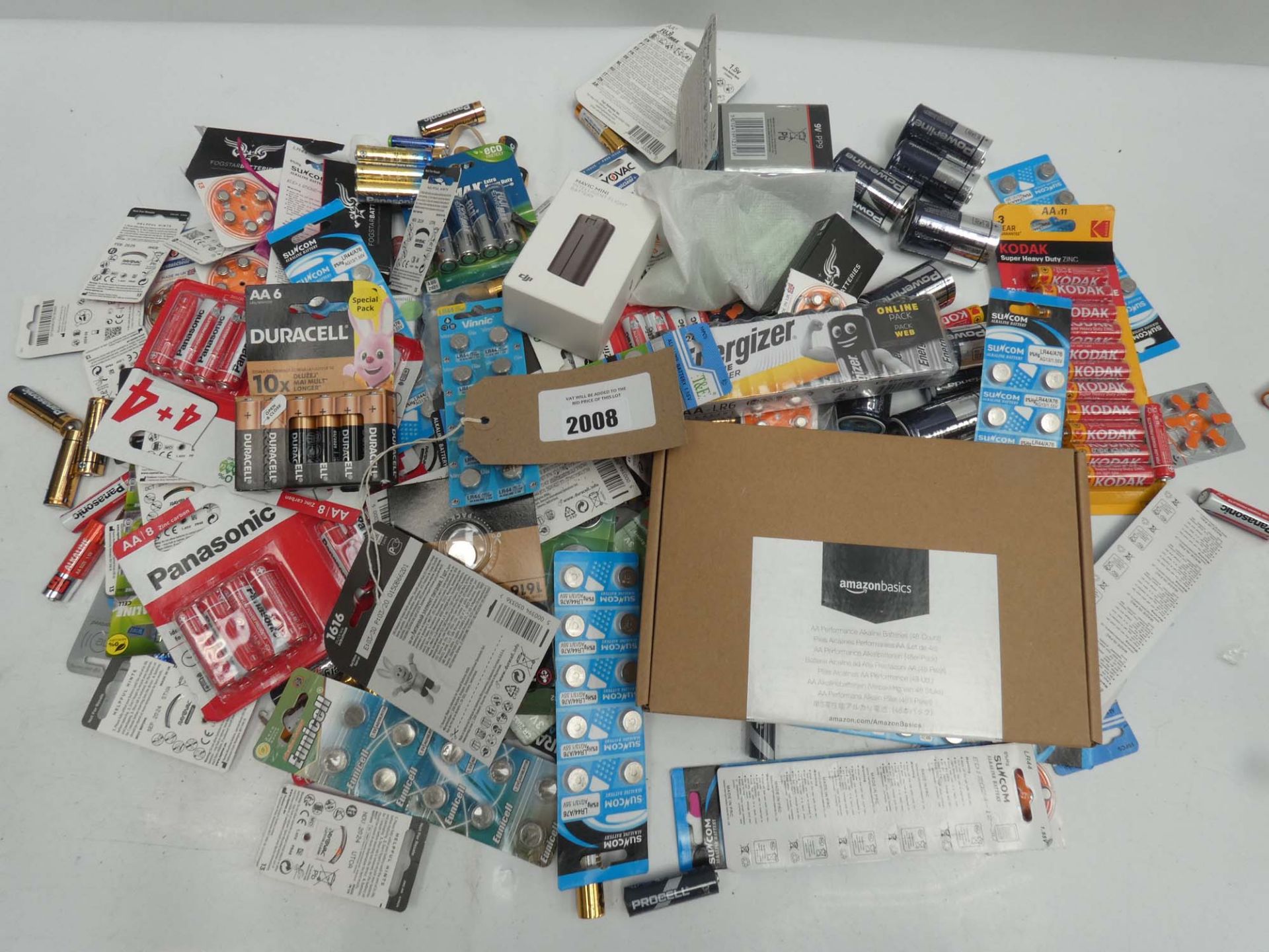 Bag containing loose and packaged batteries in various sizes