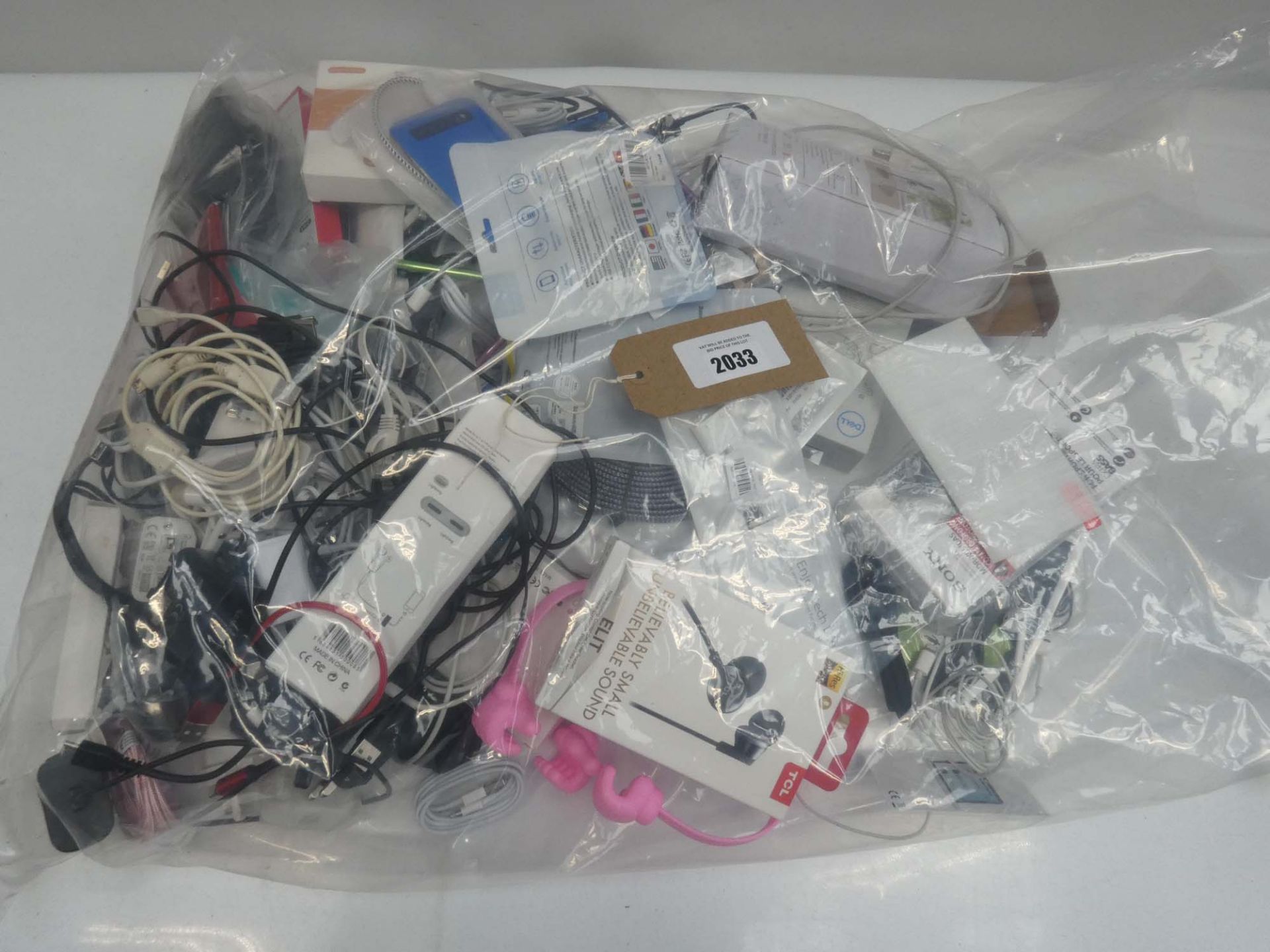 Bag containing quantity of mobile phone accessories; cables, chargers, adapters, earphones, etc