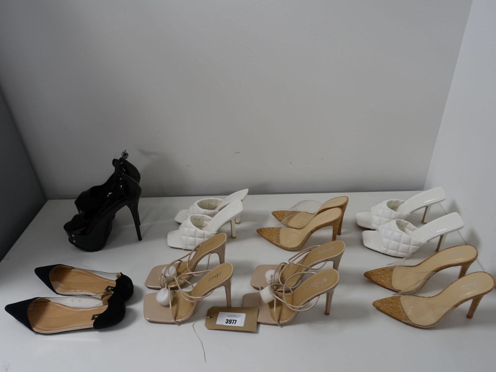 Bag of loose assorted shoes to include heels and flats (approx 10 pairs)