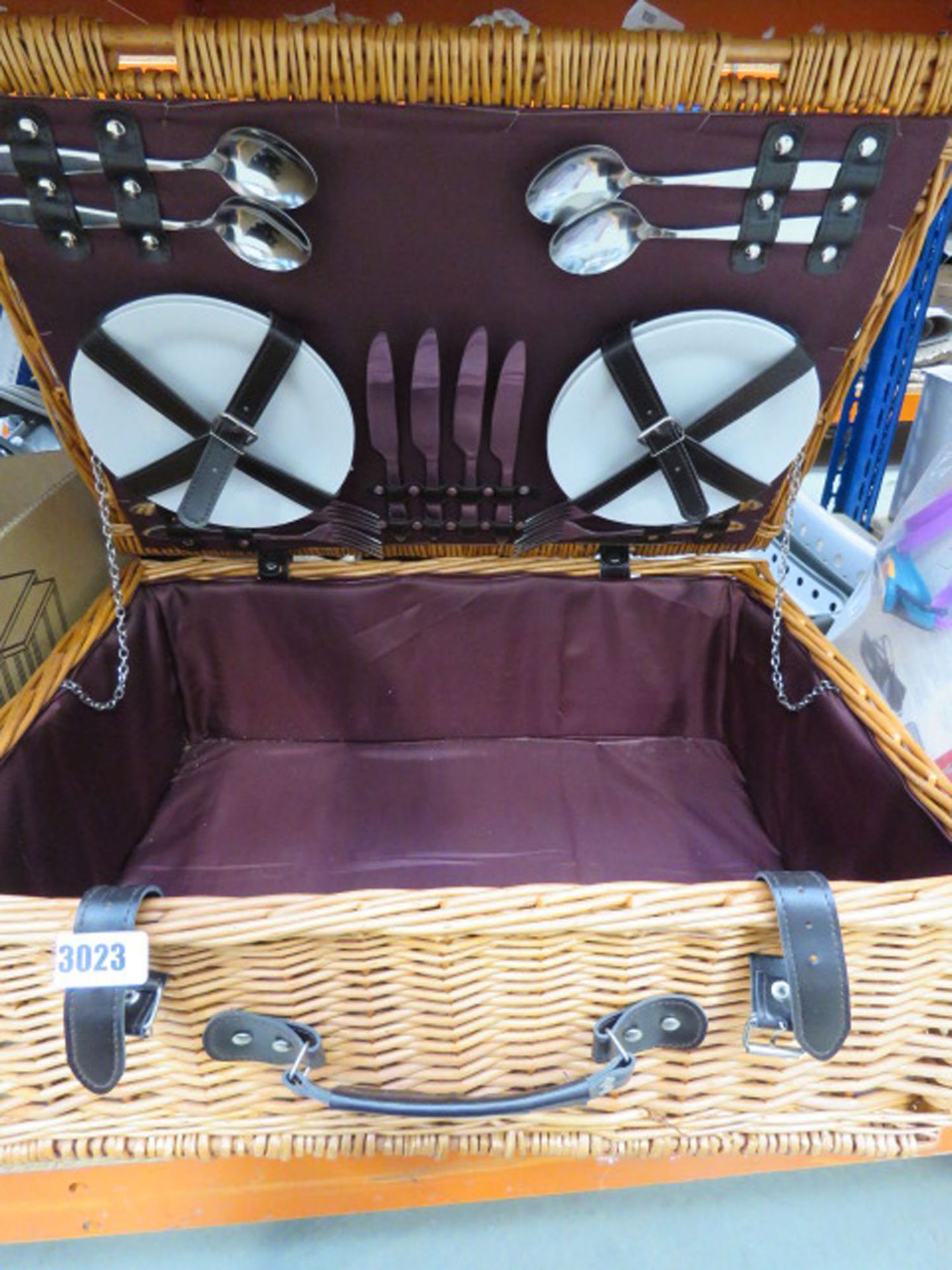 Picnic basket hamper containing plates and cutlery