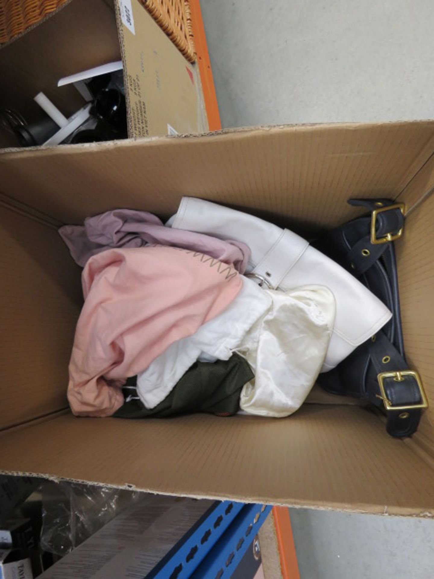 Box containing mixed style ladies handbags and purses, some with dust bags