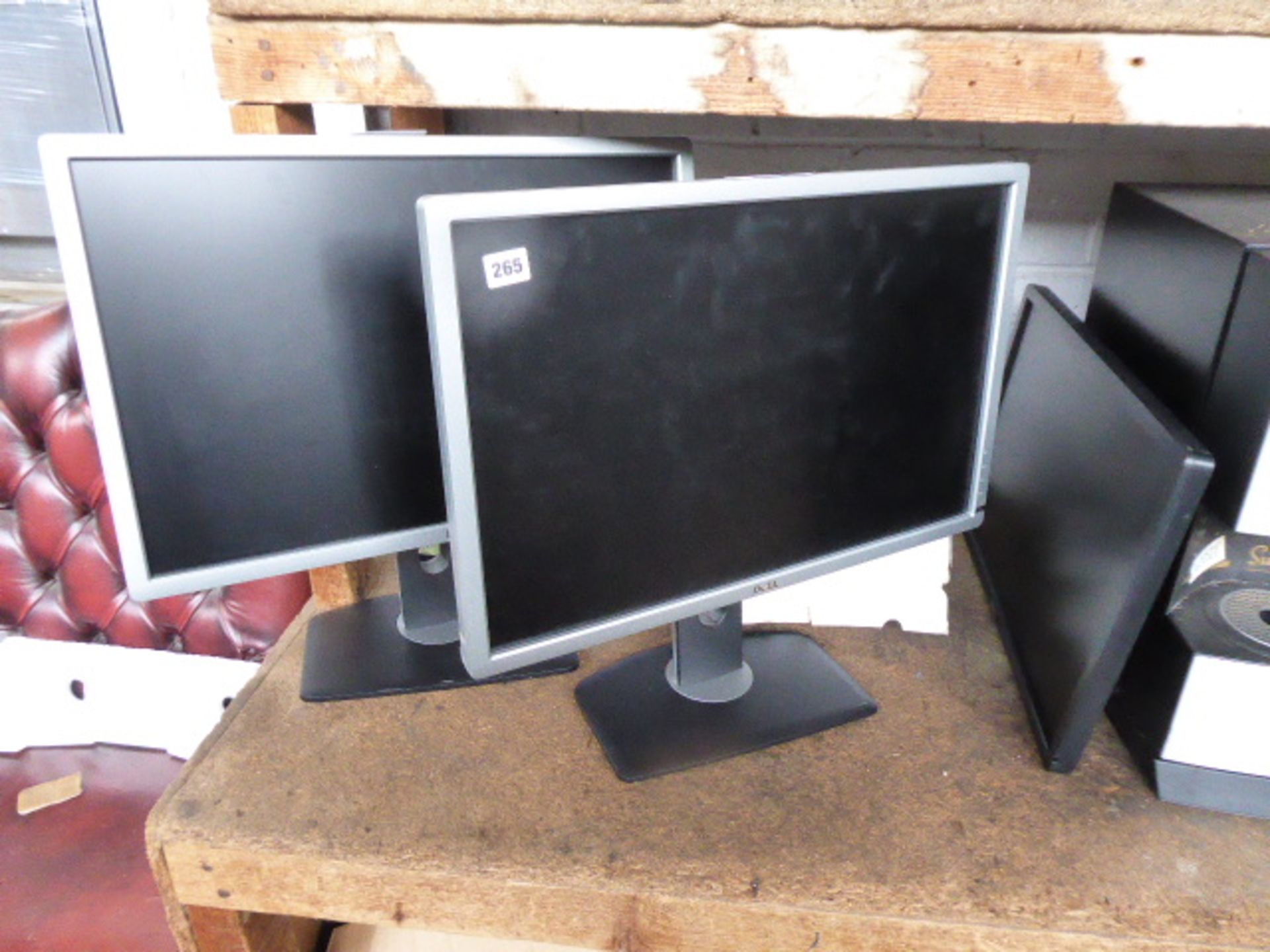 2 large Dell flat screen monitors with stands and 1 monitor without stand